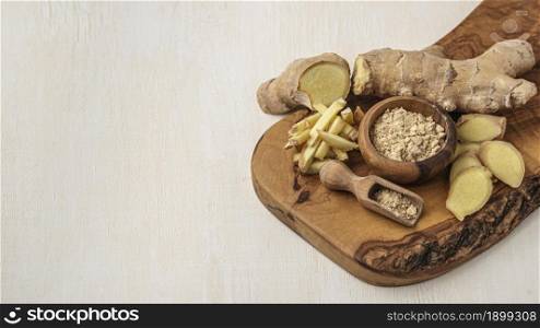 Assortment of ginger on wooden board with copy space Picture on pik. Resolution and high quality beautiful photo. Assortment of ginger on wooden board with copy space Picture on pik. High quality beautiful photo concept
