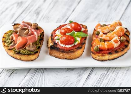 Assortment of Italian bruschettas with different toppings