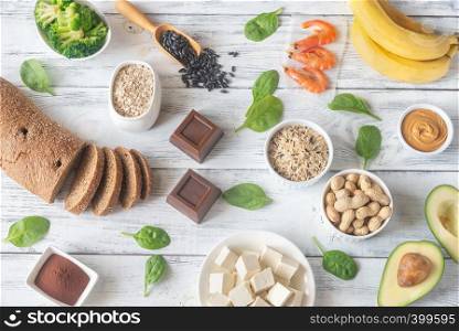 Assortment of magnesium-rich foods on the wooden background