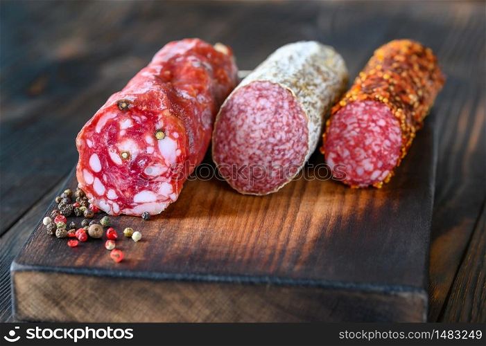 Assortment of salami on the wooden board