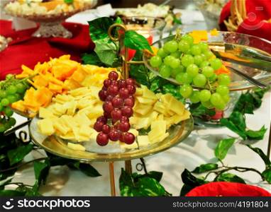 assortment of snacks and fruits on a party table