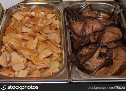 Assortment of Vegetables Preserved in Oil, Marinated Vegetables inside Metallic Bowl in Restaurant