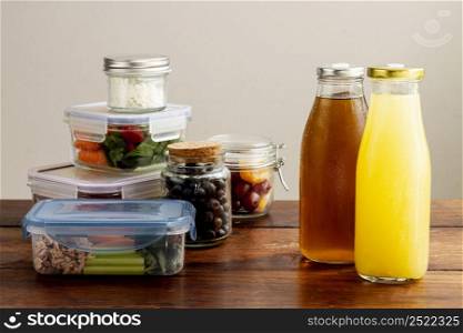 assortment with packed food juice bottles