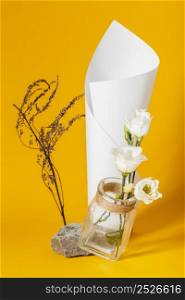 assortment with white roses vase with paper cone