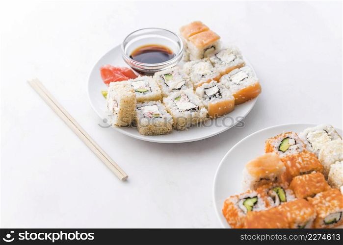 assortments sushi with sauce chopsticks