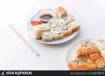 assortments sushi with sauce chopsticks