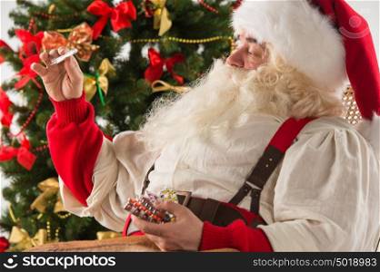 Astonished Santa Claus measuring his temperature with thermometer, feeling ill. Christmas in Danger!