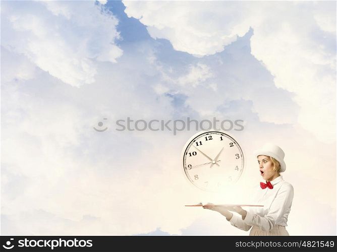 Astonished woman looking in book. Young woman in white hat with opened book in hands and clock on pages
