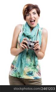 Astonished woman with a vintage camera, isolated over white background