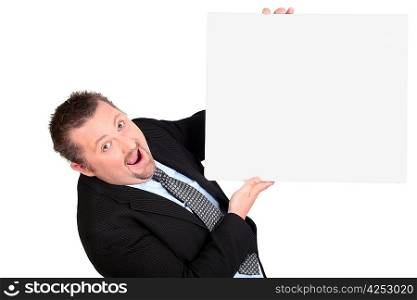 Astounded businessman with a blank board