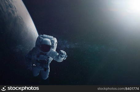 Astronaut and space background. Elements of this image furnished by NASA.