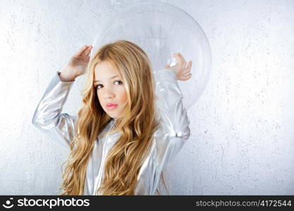 Astronaut futuristic kid girl with silver uniform and glass helmet