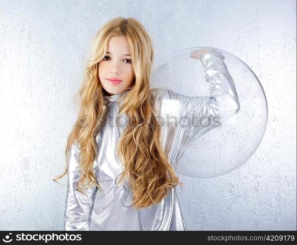 Astronaut futuristic kid girl with silver uniform and glass helmet