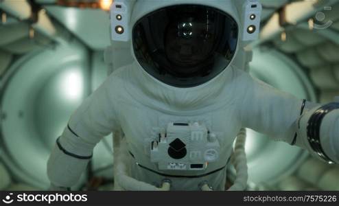 astronaut inside the orbital space station. Elements of this image furnished by NASA.. astronaut inside the orbital space station