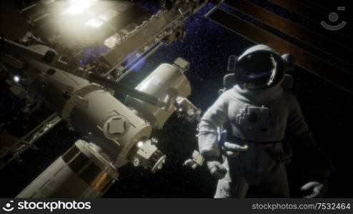 Astronaut outside the International Space Station on a spacewalk. Elements of this image furnished by NASA. Astronaut outside the International Space Station on a spacewalk