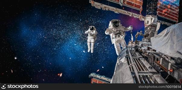 Astronaut spaceman do spacewalk while working for space station in outer space . Astronaut wear full spacesuit for space operation . Elements of this image furnished by NASA space astronaut photos.. Astronaut spaceman do spacewalk while working for space station