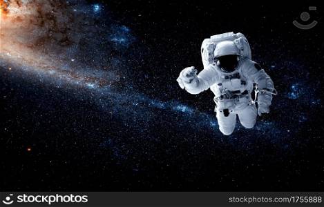 Astronaut spaceman do spacewalk while working for space station in outer space . Astronaut wear full spacesuit for space operation . Elements of this image furnished by NASA space astronaut photos.. Astronaut spaceman do spacewalk while working for space station