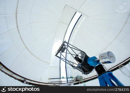 Astronomic observatory telescope inside a white dome