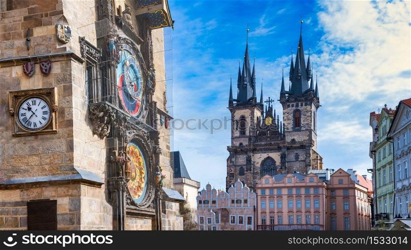Astronomical clock in the old square of Prague with the church of the Virgin Mary of Tyn.