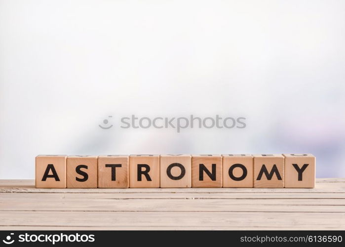 Astronomy sign made with wooden cubes on a table