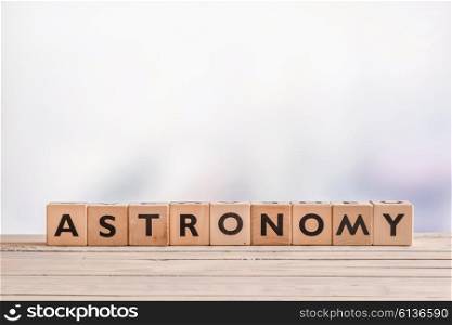 Astronomy sign made with wooden cubes on a table
