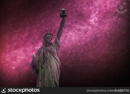 Astrophotography, starry sky shines at night. Statue of Liberty Neoclassical sculpture on Liberty Island southwest of Manhattan Island, USA. Astrophotography, starry sky shines at night. Statue of Liberty