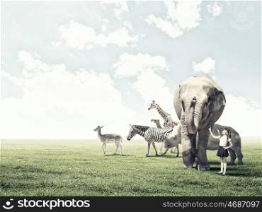 At biology lesson. Cute school girl outdoor with wild animals