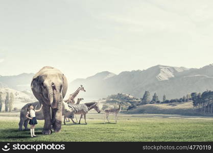 At biology lesson. Cute school girl outdoor with wild animals