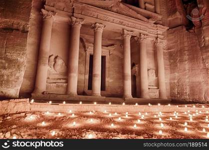 At night, the Treasury of Petra in Jordan is often illuminated by the light from hundreds of candles.