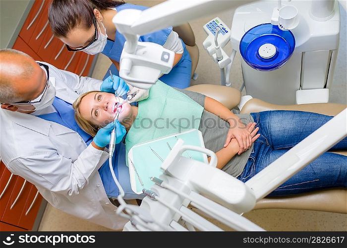 At the dentist young woman patient lying on dental chair