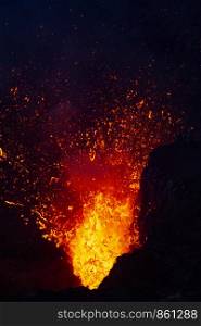 At volcanic eruption, Yasur spits lava and fire with contrast