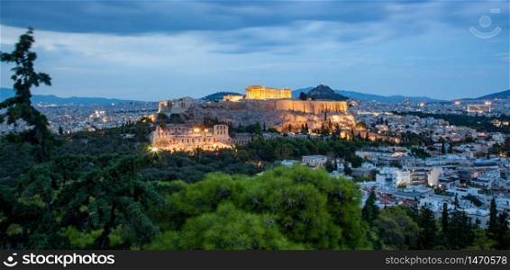 athens seen from Philopapou hill with views to Herodium , Acropolis and the Parthenon at blue hour, Attica, Greece