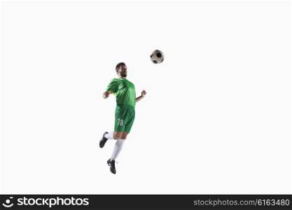 Athlete chesting soccer ball