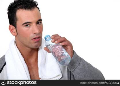 Athlete drinking water after physical effort