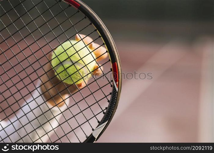 athlete holding racket ball