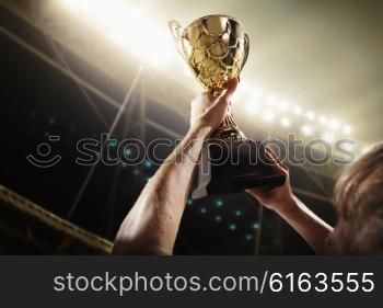 Athlete holding trophy cup