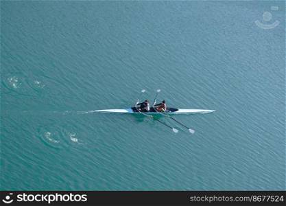 athlete in canoe on the Nervion river in Bilbao city, Basque country, spain