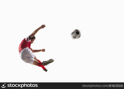 Athlete kicking soccer ball