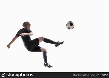 Athlete kicking soccer ball