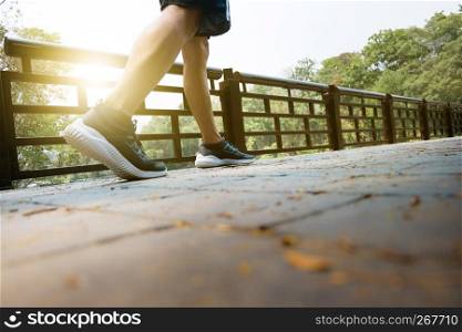 athlete man tired walks exercising in a park, workout concept