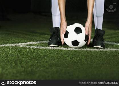 Athlete placing soccer ball for corner kick