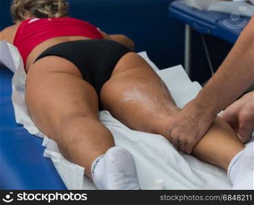 Athlete&rsquo;s Calf Muscle Professional Massage Treatment after Sport Workout, Fitness and Wellness