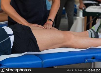 Athlete&rsquo;s Quadriceps Muscle Professional Massage Treatment after Sport Workout, Fitness and Wellness