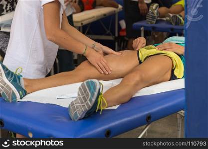 Athlete's Thig Muscle Professional Massage Treatment after Sport Workout Fitness and Wellness. Athlete's Muscles Massage after Sport Workout