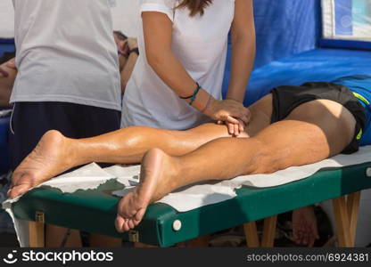Athlete&rsquo;s Thig Muscle Professional Massage Treatment after Sport Workout; Fitness and Wellness
