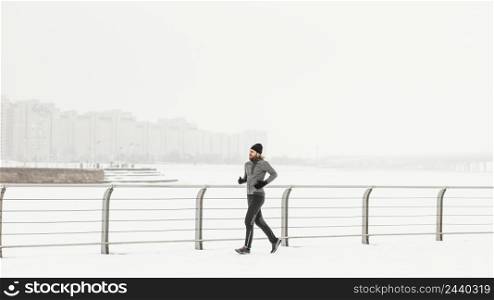 athlete running outdoors snow