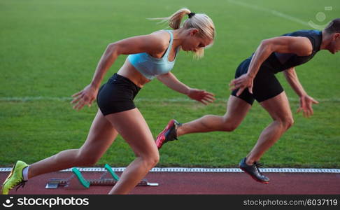 athlete woman group running on athletics race track on soccer stadium and representing competition and leadership concept in sport