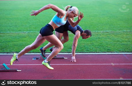 athlete woman group running on athletics race track on soccer stadium and representing competition and leadership concept in sport