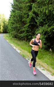 Athlete woman training for marathon run jogging outdoor in countryside