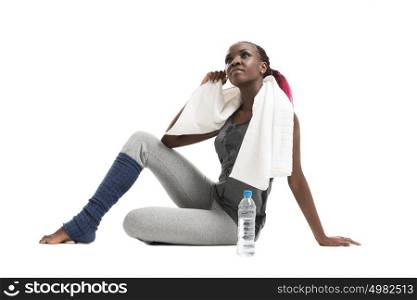Athletic girl with a bottle of water and towel
